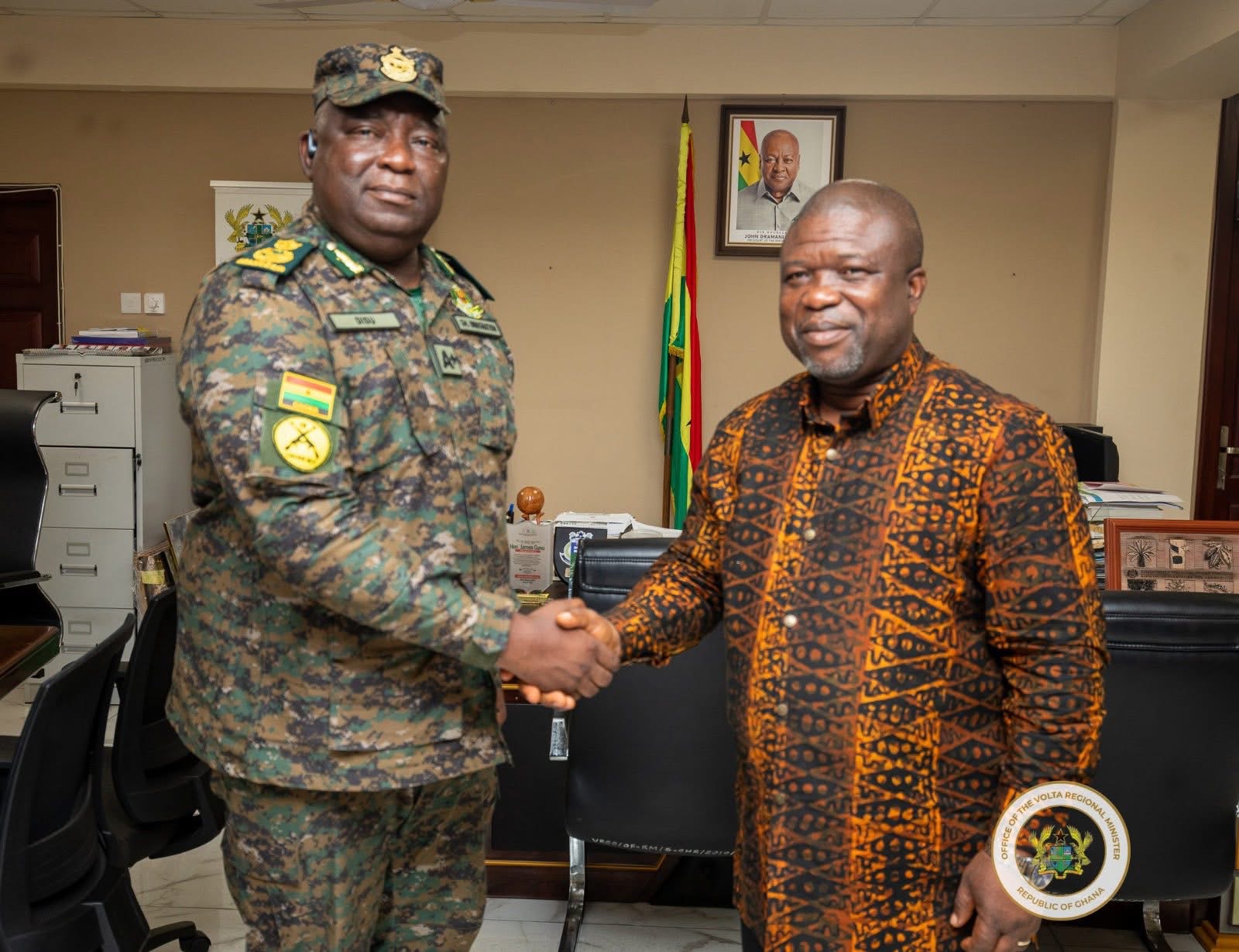 Hon. James Gunu engages the Deputy Comptroller-General (Operations) of the Ghana Immigration Service