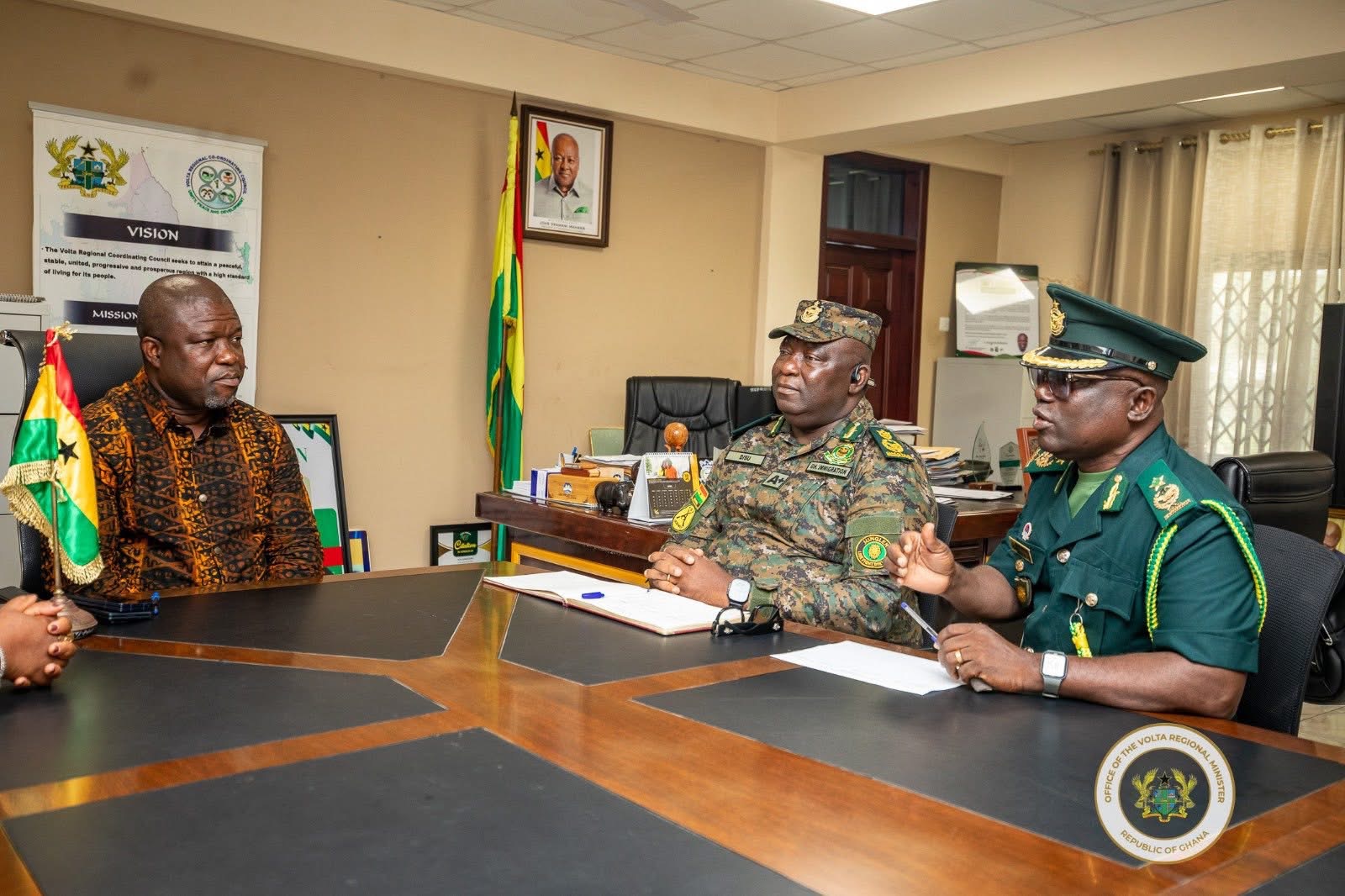 Hon. James Gunu engages the Deputy Comptroller-General (Operations) of the Ghana Immigration Service