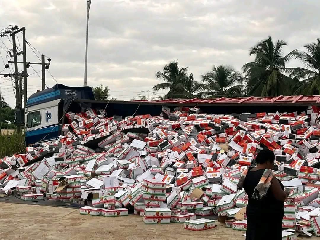 Truck Overturns at Sokpoe: Cartons of Tomatoes and Spaghetti Scatter on Road