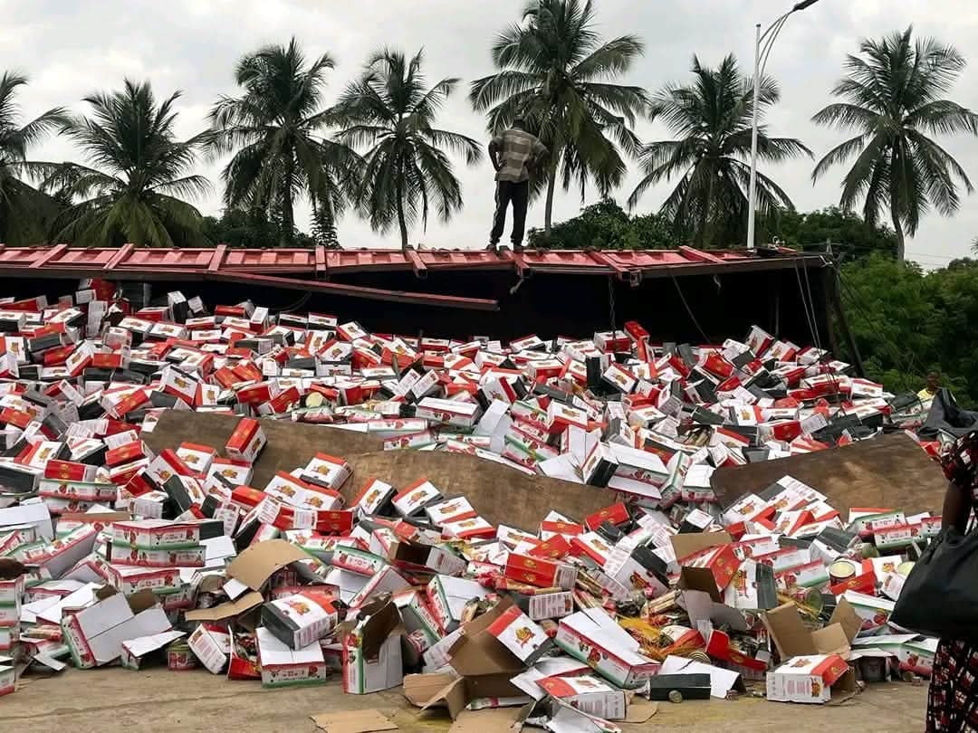 Truck Overturns at Sokpoe: Cartons of Tomatoes and Spaghetti Scatter on Road